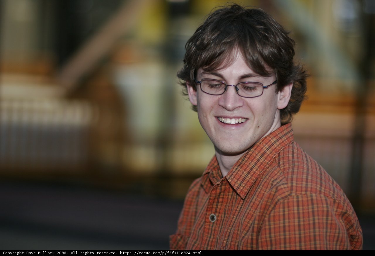 Happy Man in Plaid Shirt with Glasses