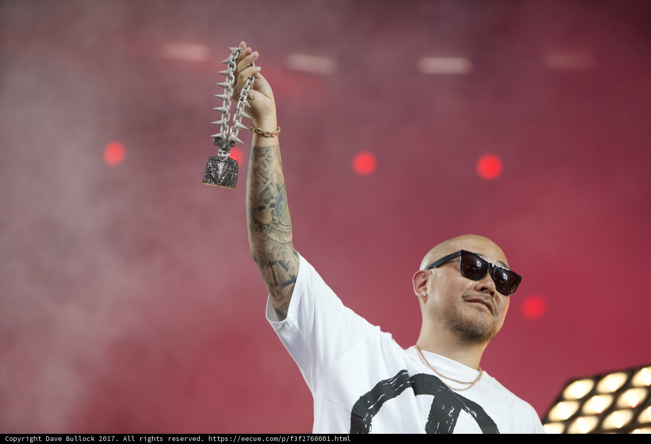 Microphone in Hand, Tattoo on Arm