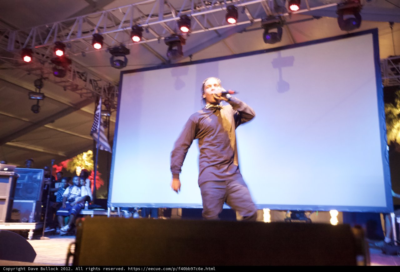 Man with a Microphone on a Spotlighted Stage