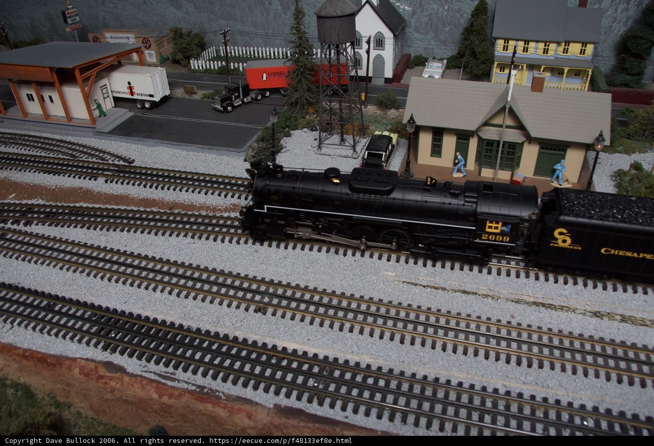Model Train Passing Through a Quaint Town
