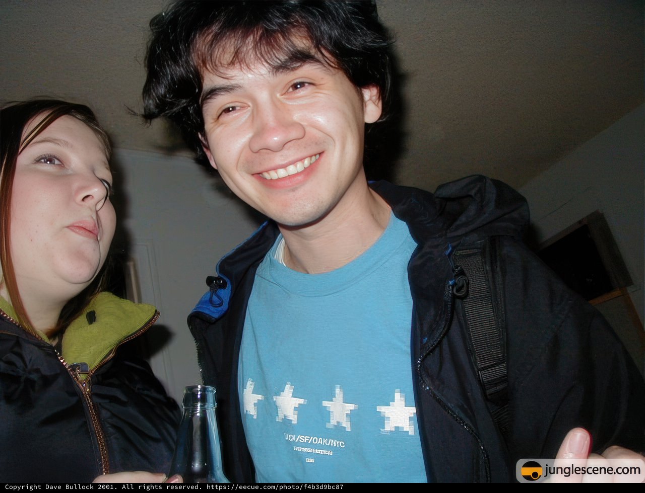 Blue Shirted Man and Woman Toast to New Year's Eve