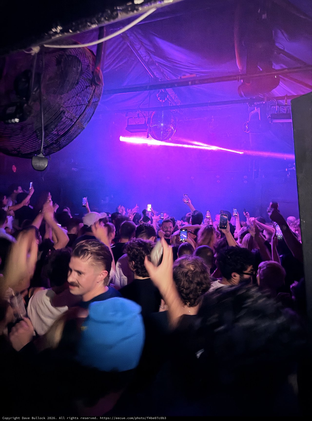 Purple-Lit Nightclub Crowd at London Venue