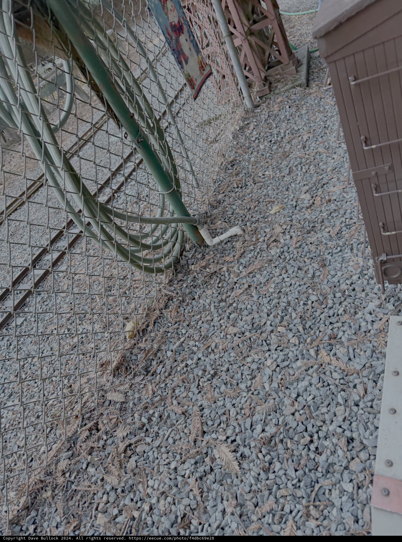 Green Chain Link Fence on Gravel Ground