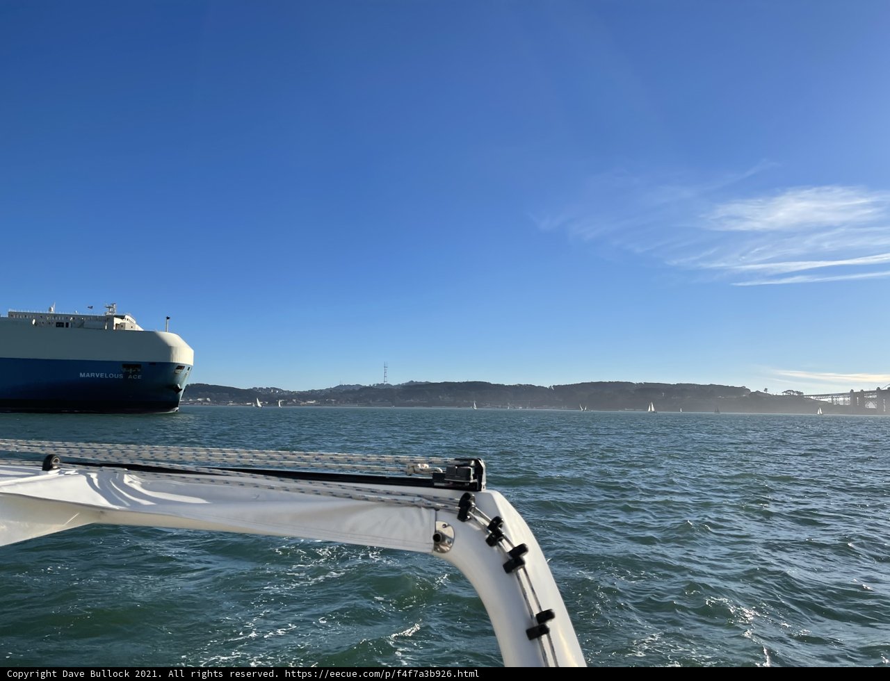 Majestic yacht sails under cloudy San Francisco sky