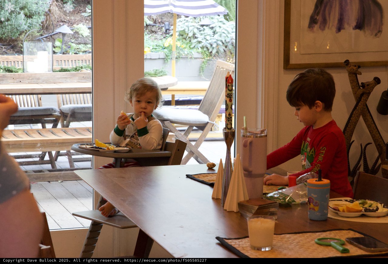 Children's Mealtime in Modern Kitchen During Christmas