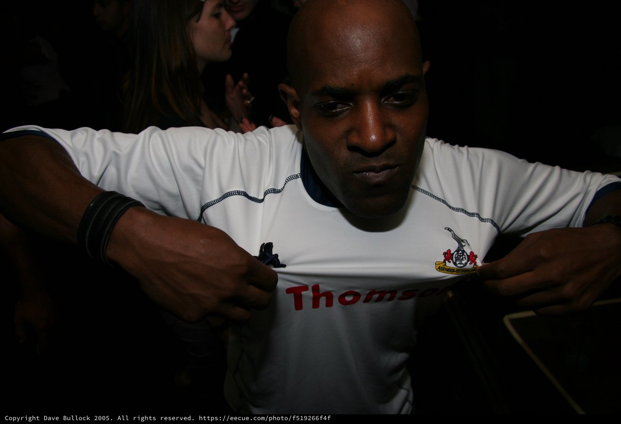 Football Fan Signs Tottenham Hotspur Jersey at Event