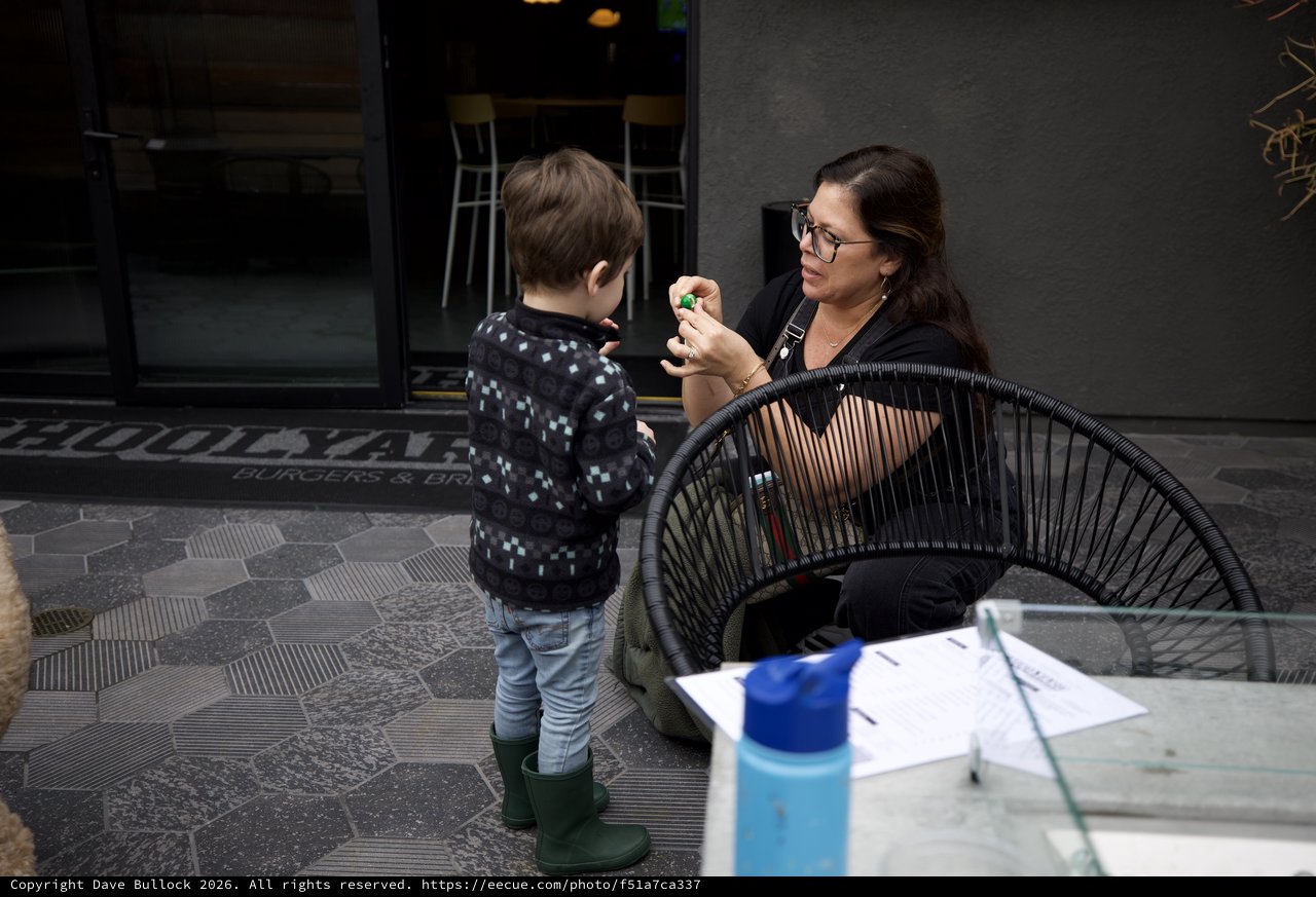 Mother and Child Moment at Urban Outdoor Café
