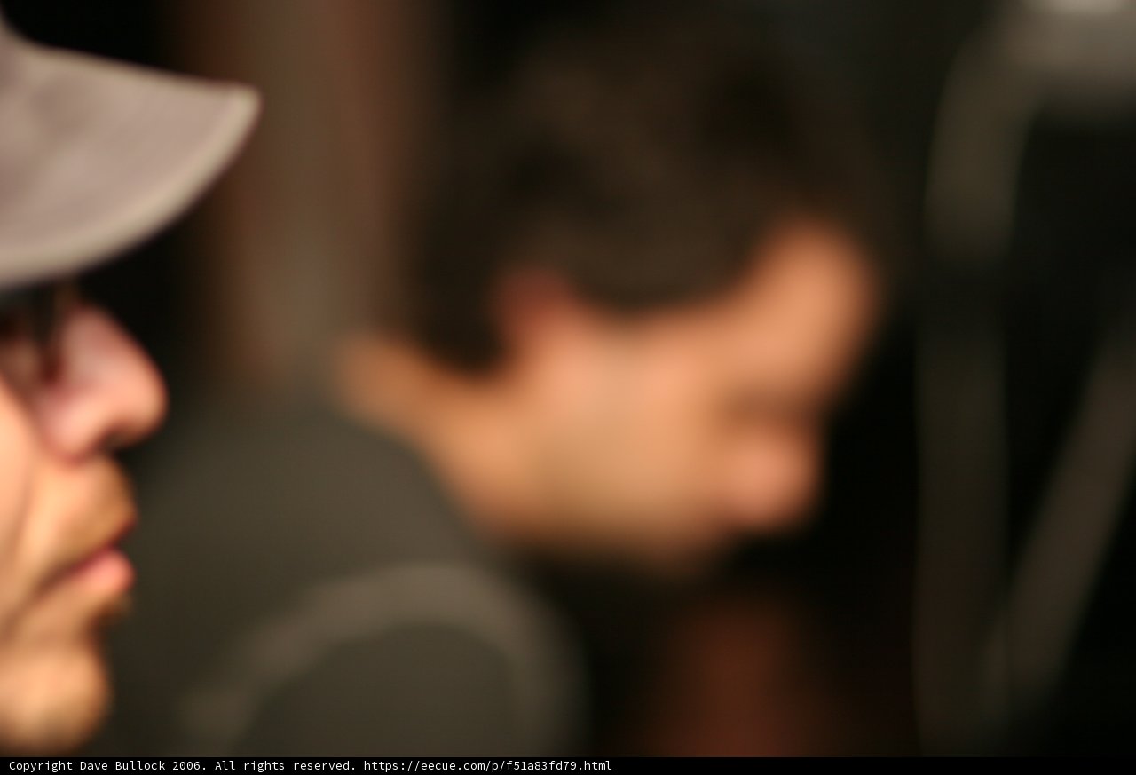 Blurry Man in Hat