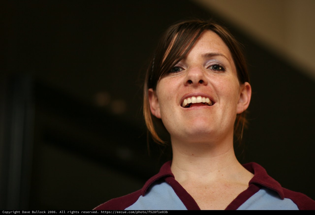 Joyful Woman Smiling Upward in Candid Portrait