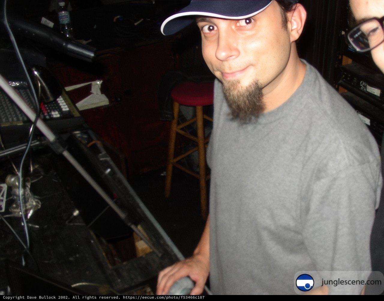 Two Men in Baseball Caps at the Keyboard