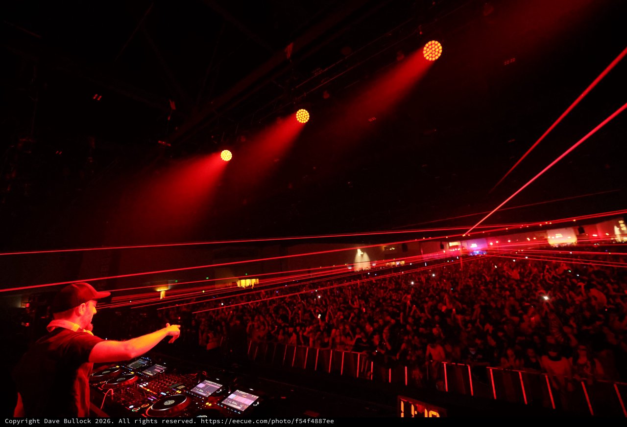 DJ Ignites Massive Crowd with Red Laser Light Show