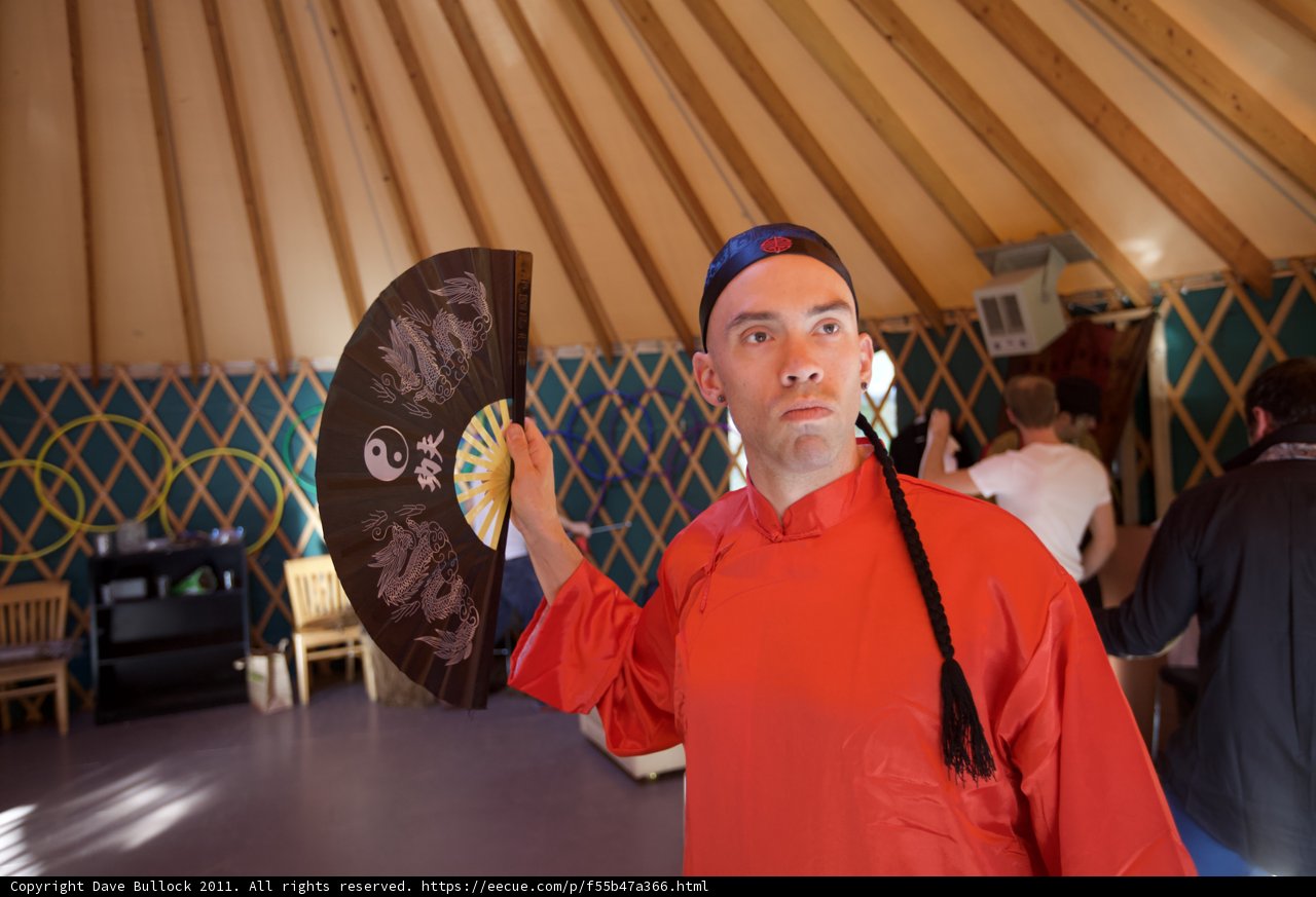 Man in Red Shirt with Fan at Wickstrom Wedding