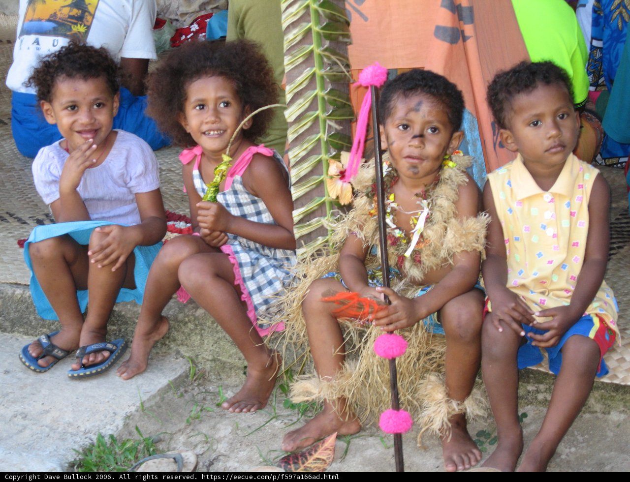Group of Children Admiring Flower Arrangement on Bench