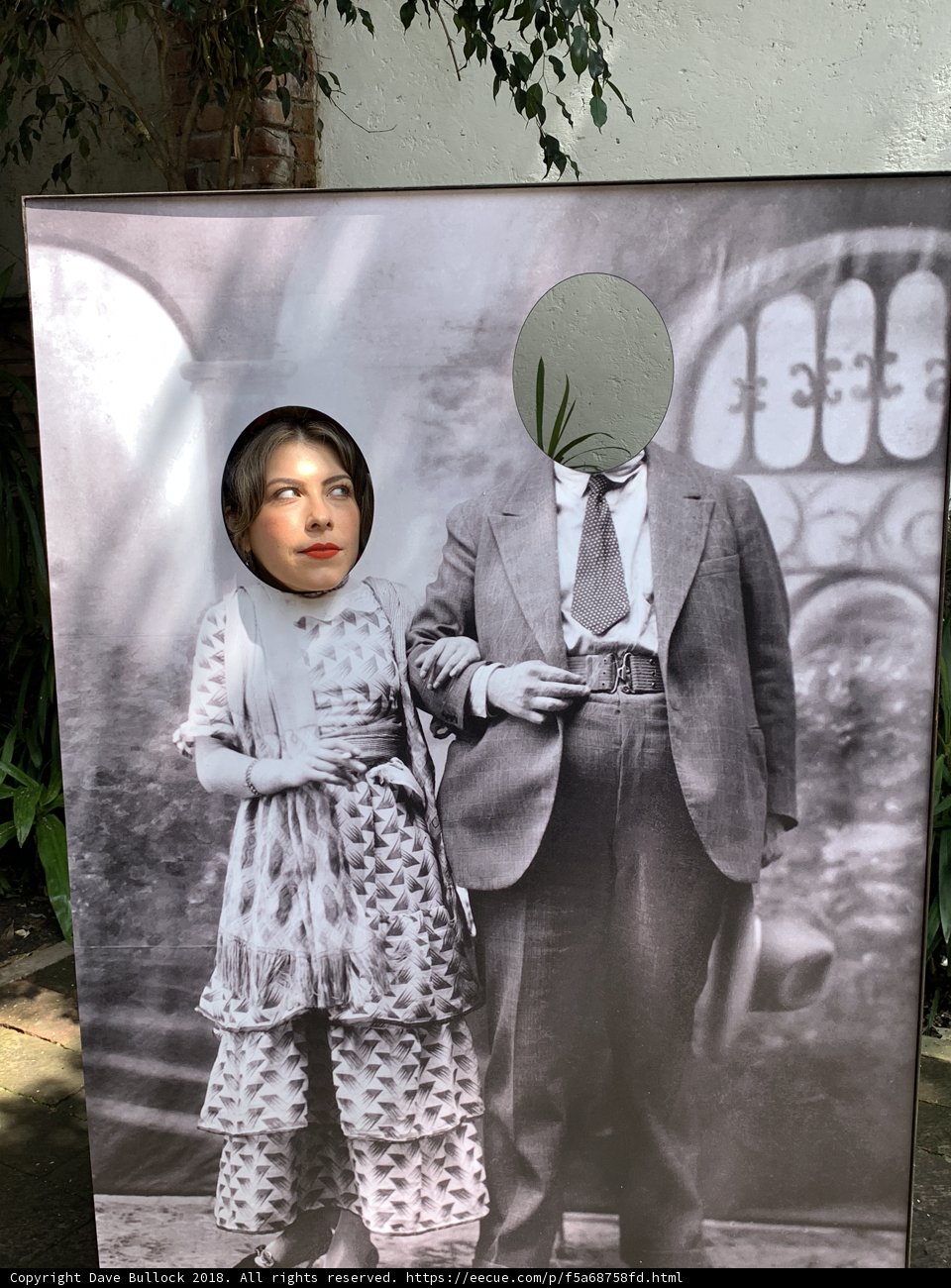 Formal Portrait of a Man and Woman in Front of a Painting