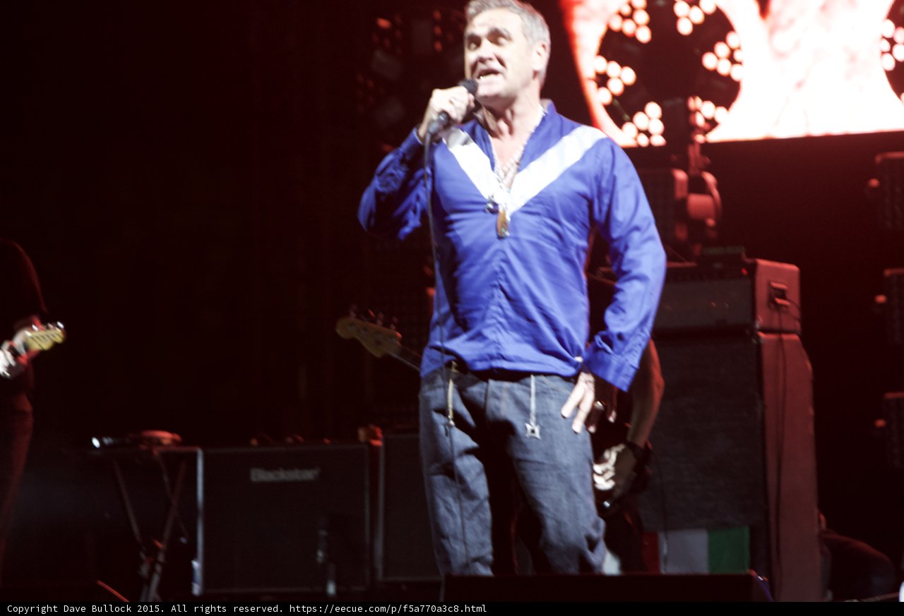 Morrissey Full Body Singing Blue Shirt Guitarist Blackstar Amp Red Video Screen Circular Lights