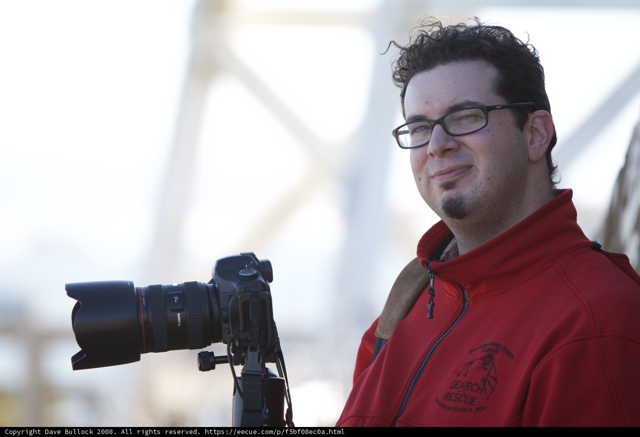 Photographer in Red Jacket with Camera