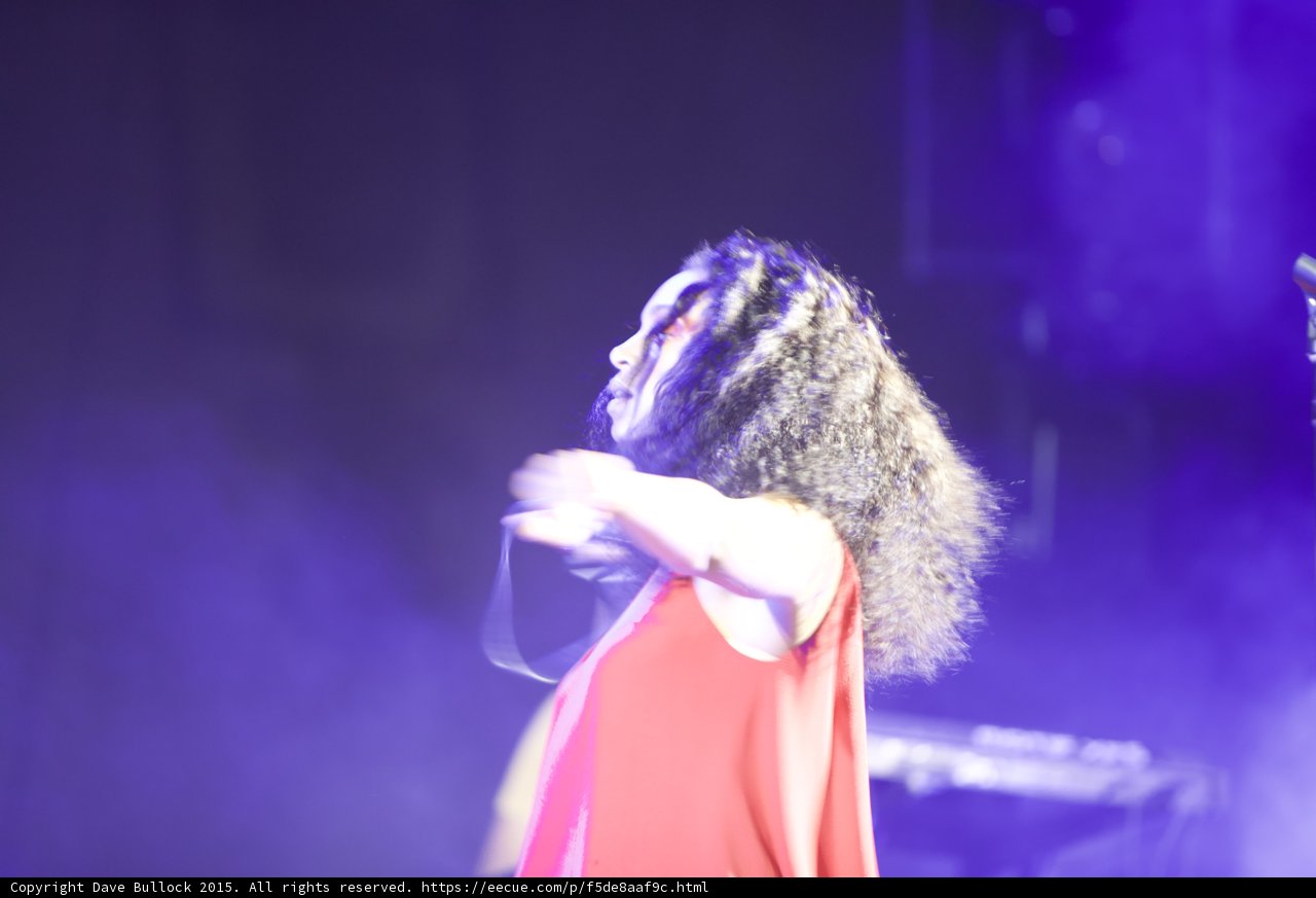 Solange Profile Arm Across Body Head Tilted Back Purple