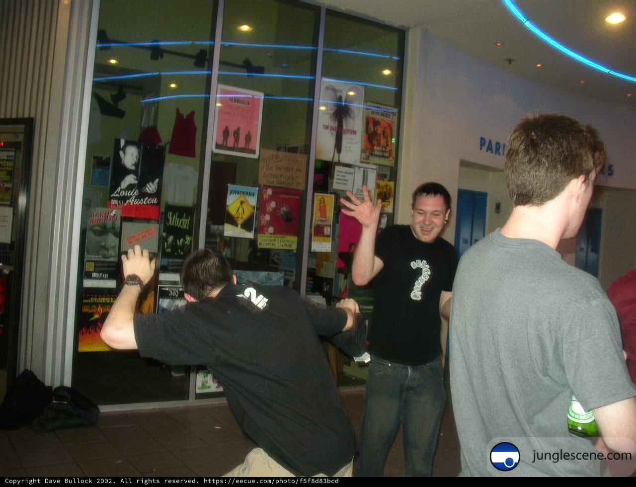 A Group of Eight in Front of the Glass Door