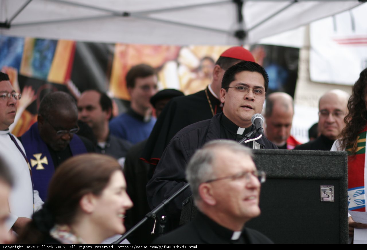 Priest Addresses Rally-Goers