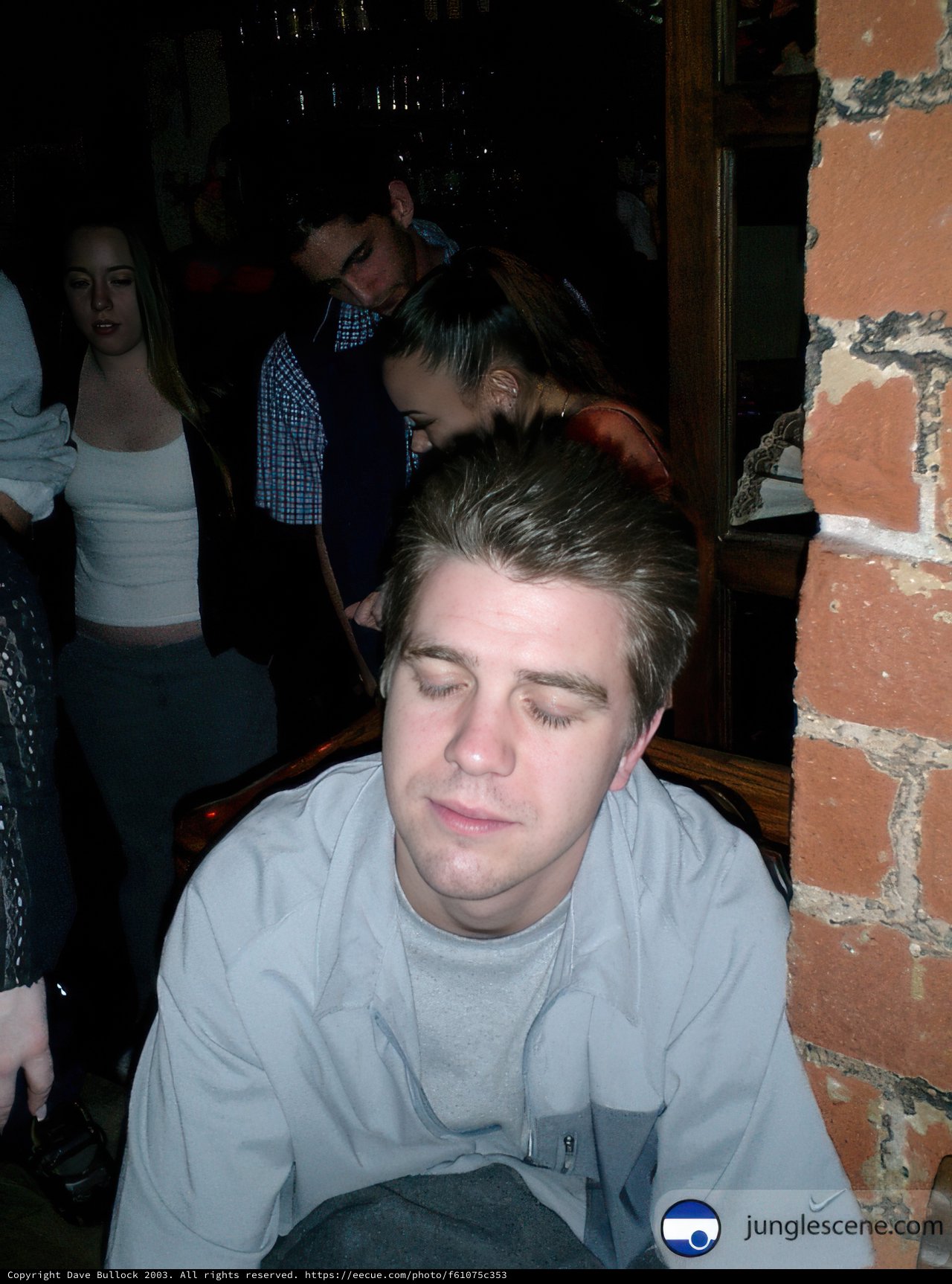 Man Enjoying a Drink at a Cozy Pub