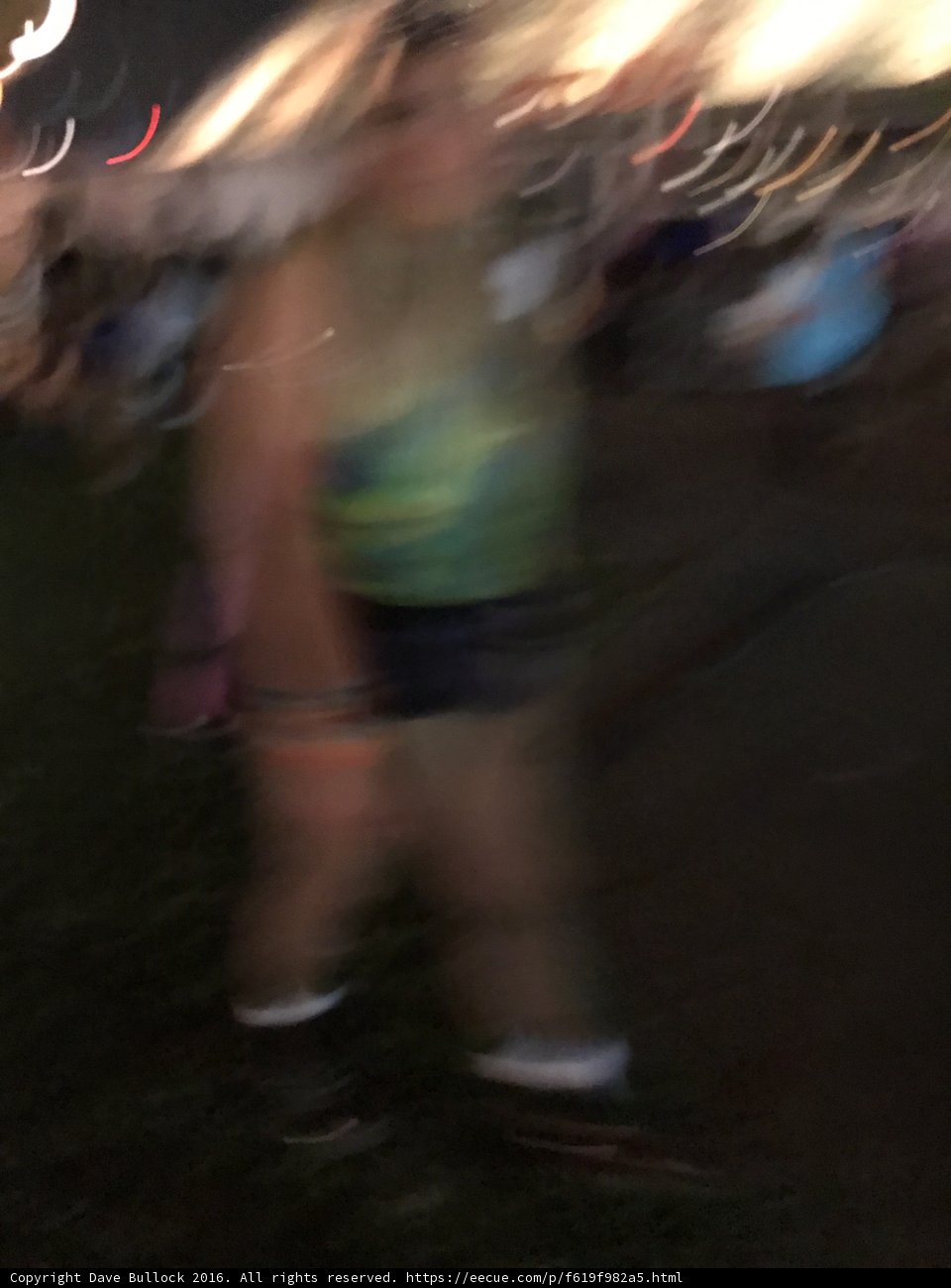 Blurry Nighttime Walk at Music Festival