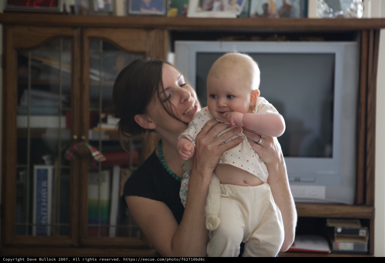 Mother and Baby Share a Joyful Moment Indoors