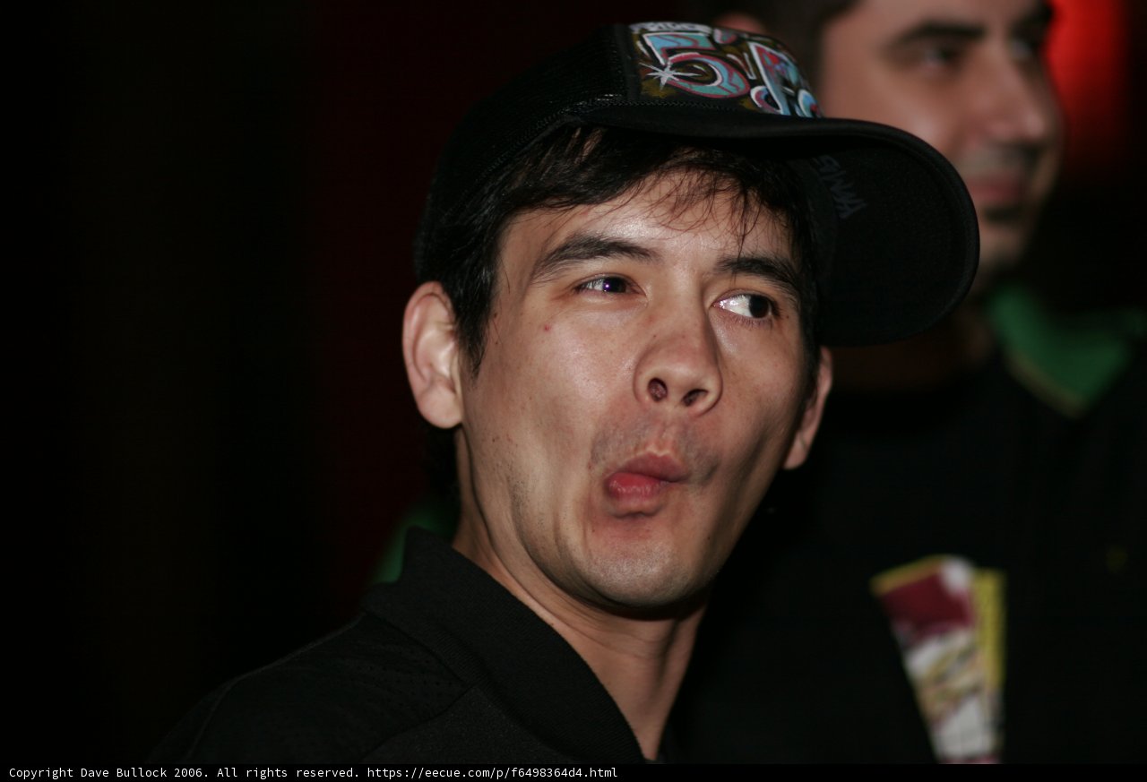 Man with Baseball Cap Making a Face
