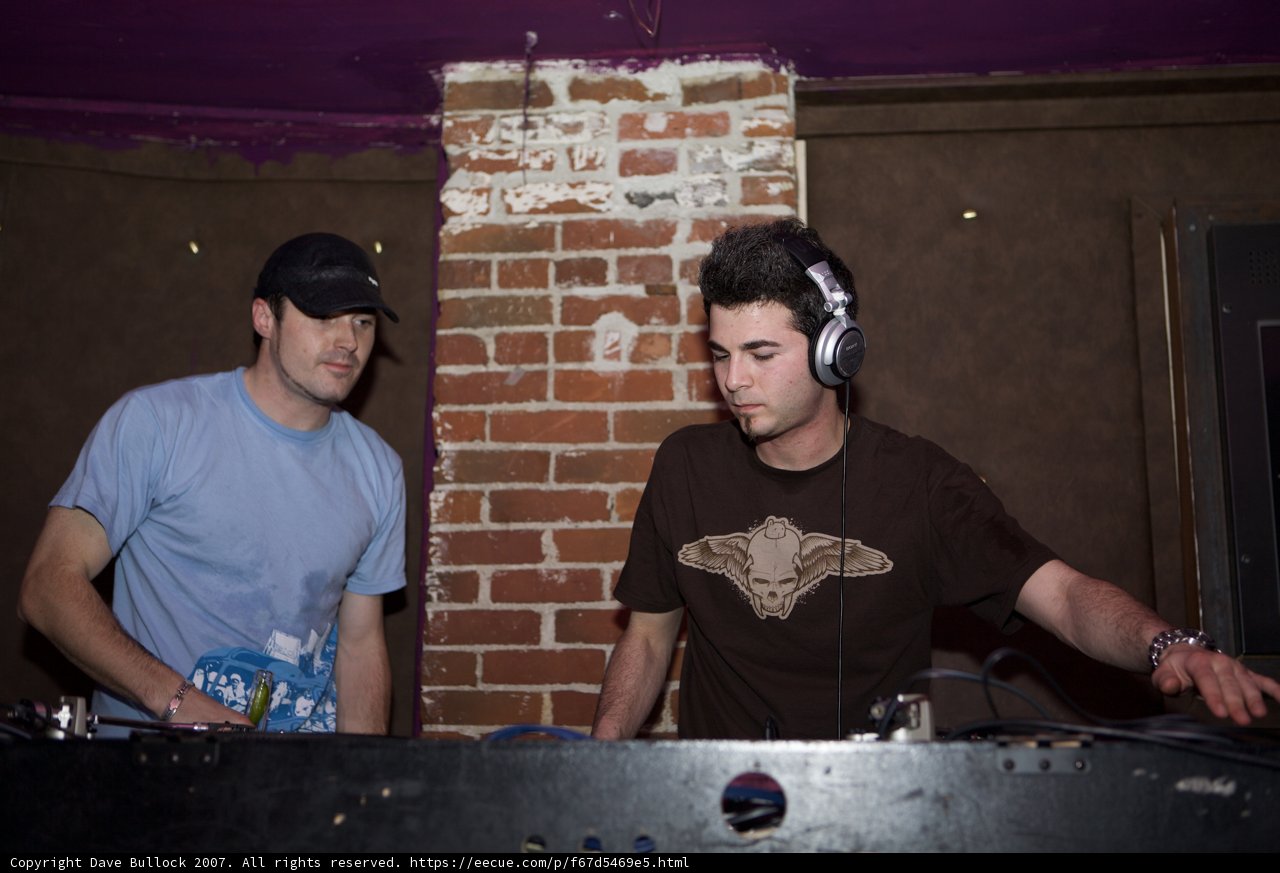 Two Men Entertain the Crowd at the DJ Booth