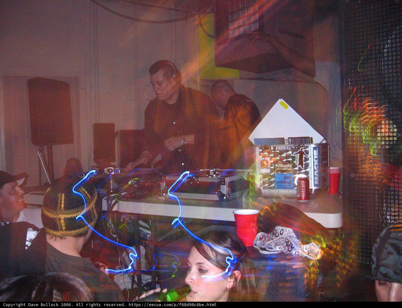 Party-goer in a Sleek Black Hat