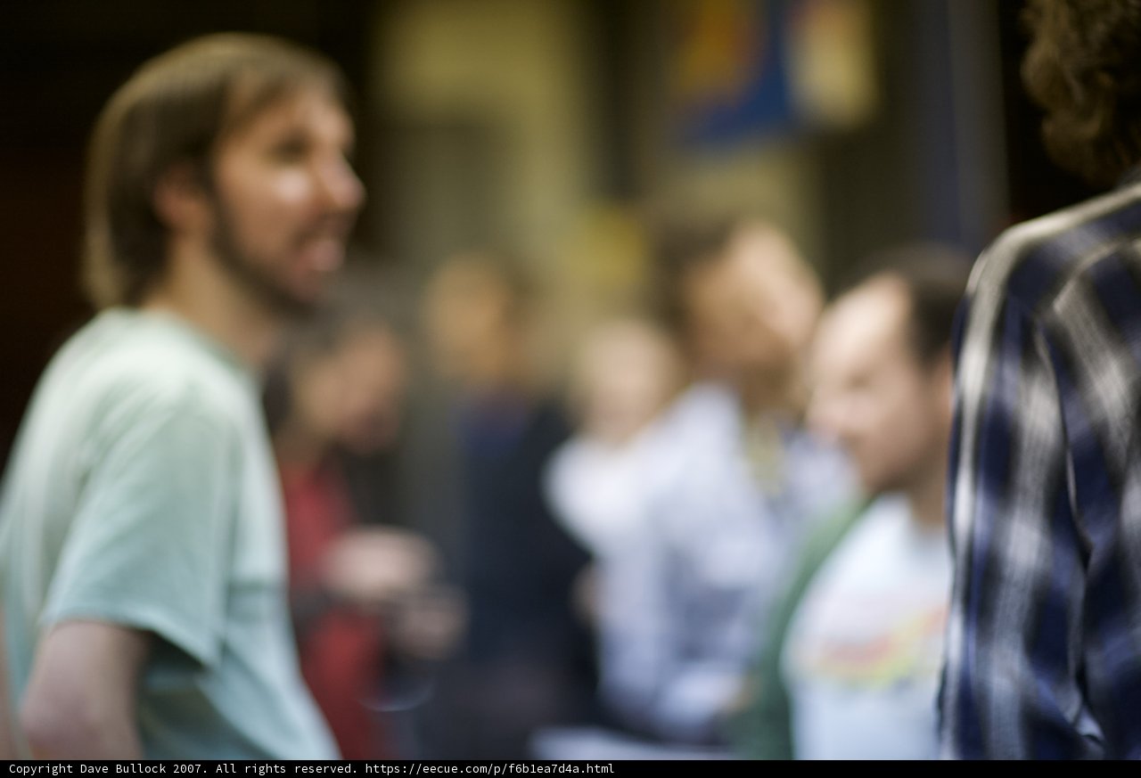 Blurry Portrait of Bearded Man in Garnet T-Shirt