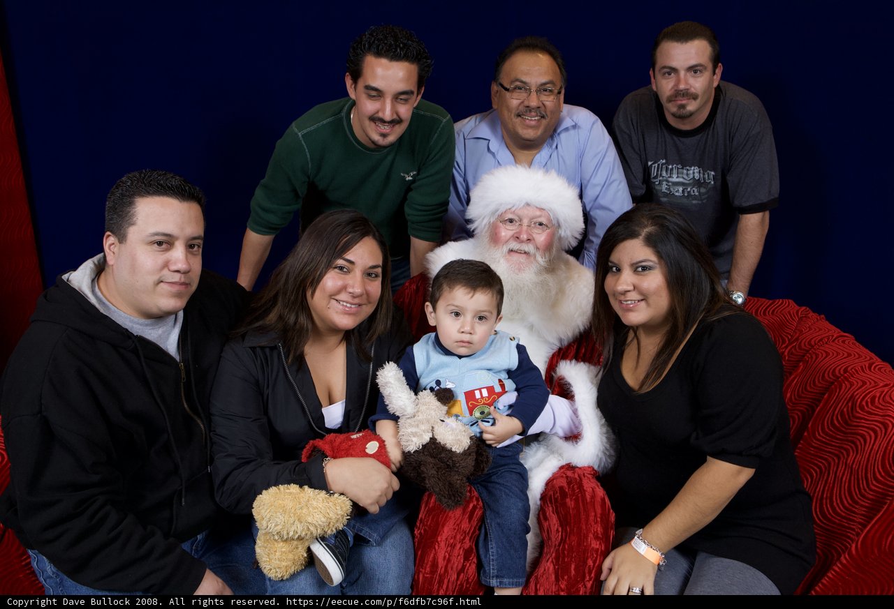 Smiling Family with Santa Claus