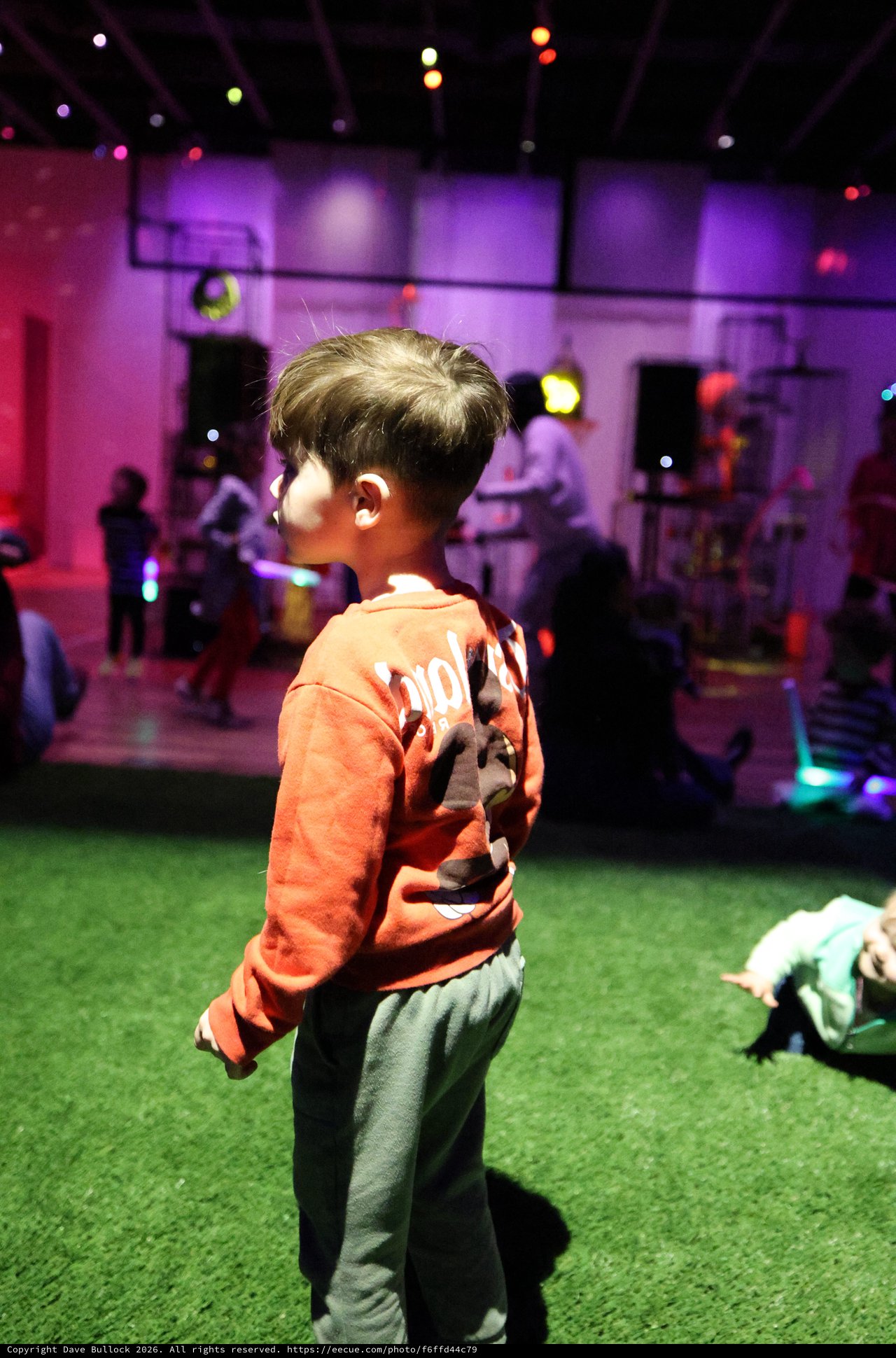 Child at Baby Rave Event in Museum Space