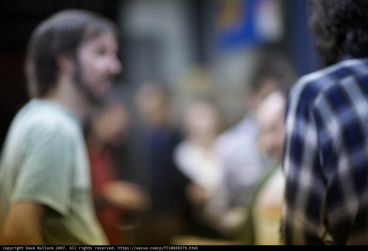 Blurred Beard in a Crowded Cafeteria