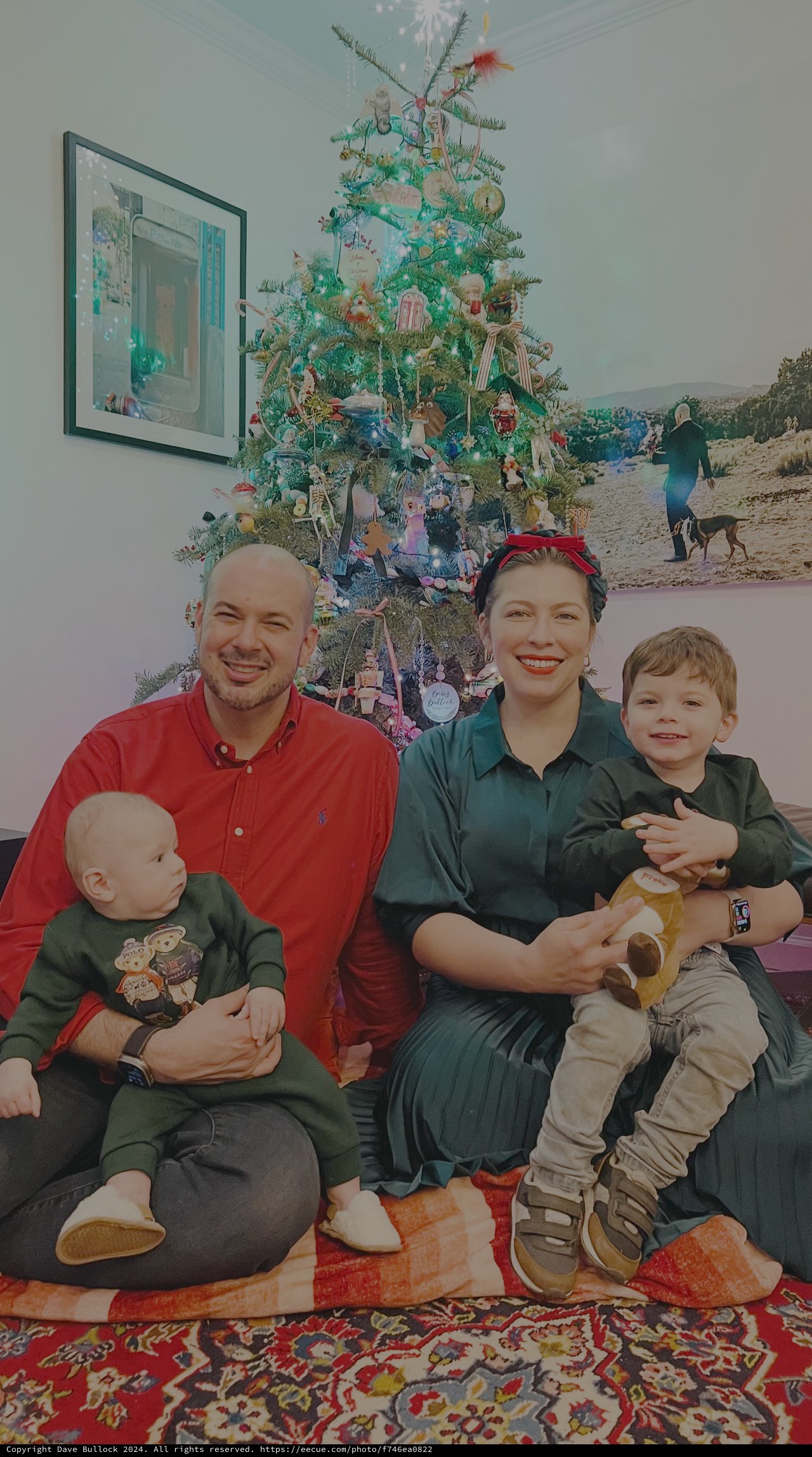 Family Christmas Morning Portrait by Tree