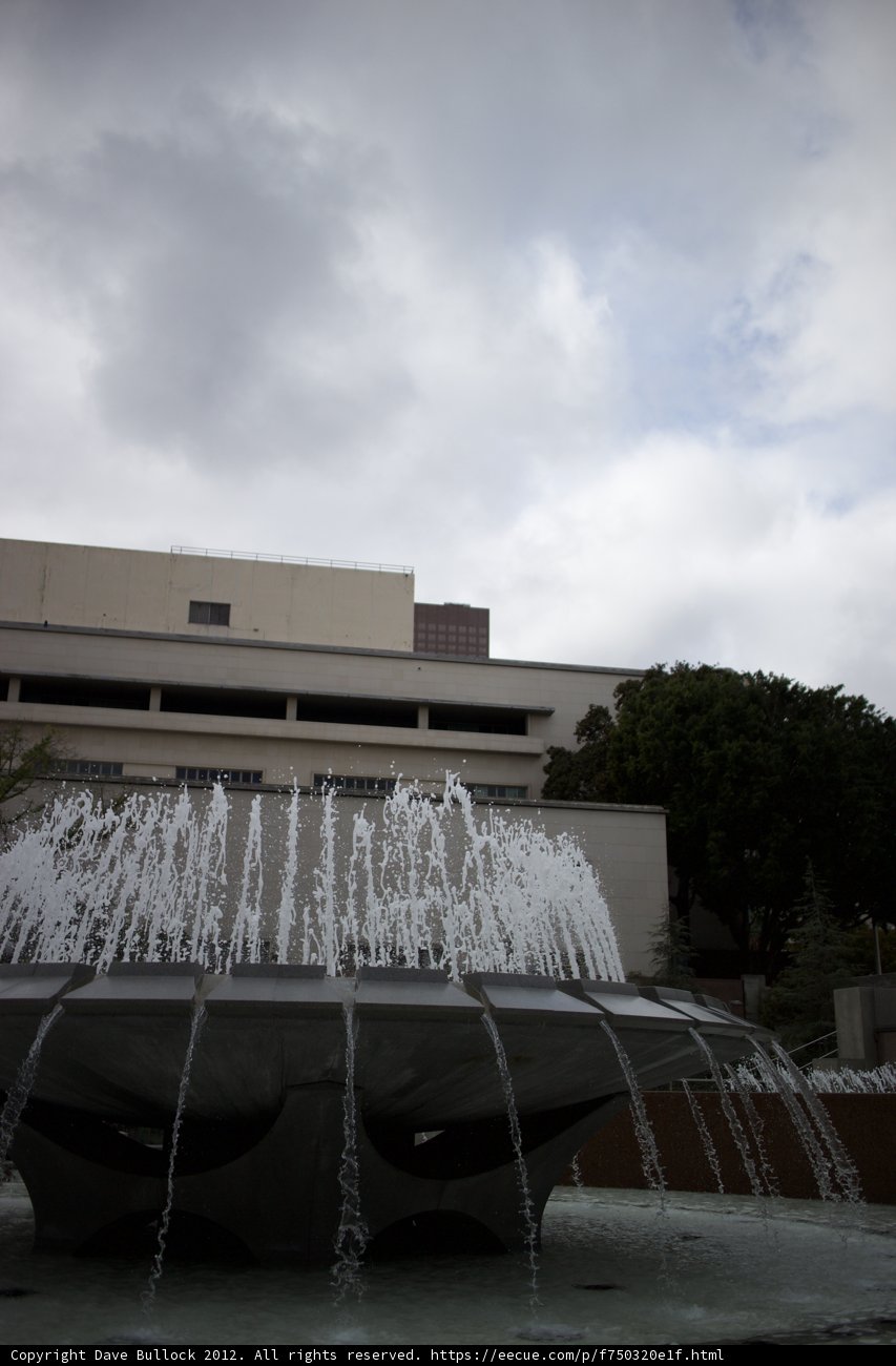 Serene Fountain in front of a Majestic Building