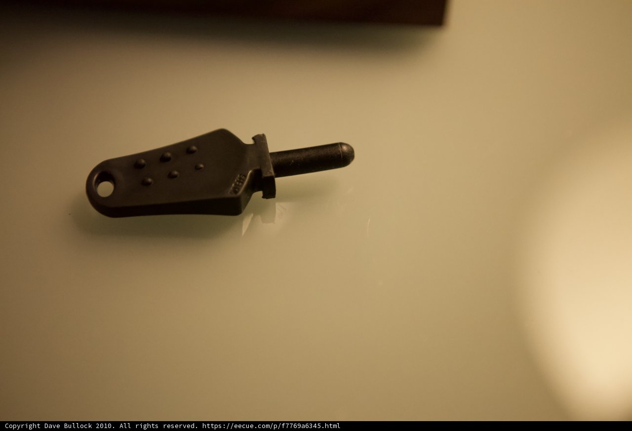 Black Key on White Wall