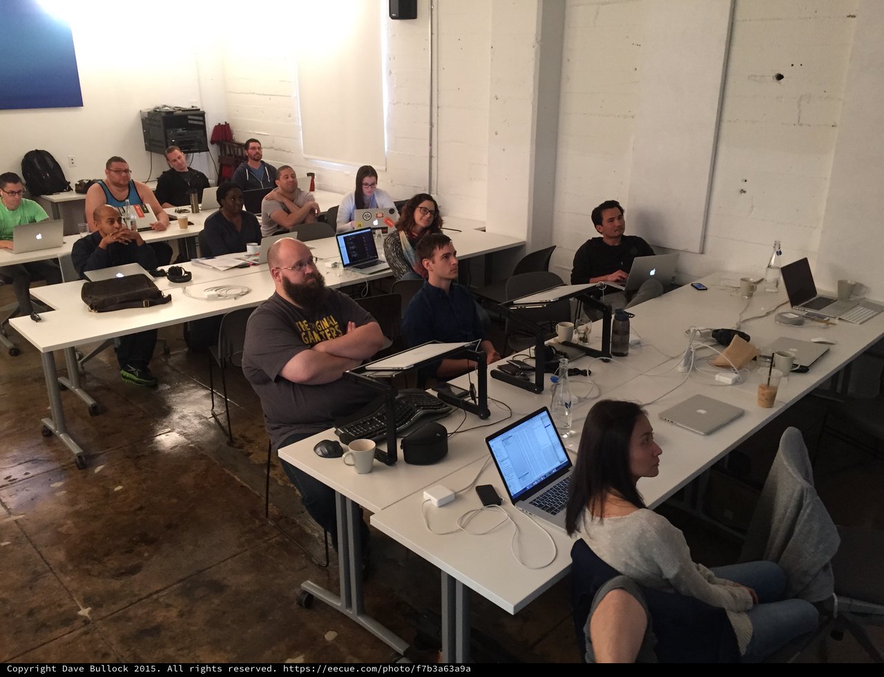Tech Workshop Attendees Focused on Presentation Screen