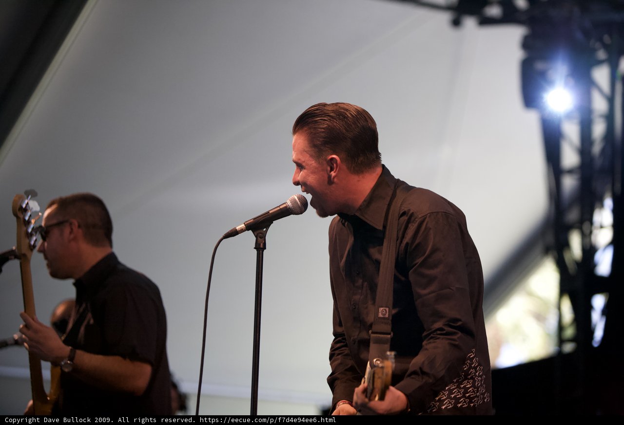 Two Men Belt Out Their Tunes on Stage
