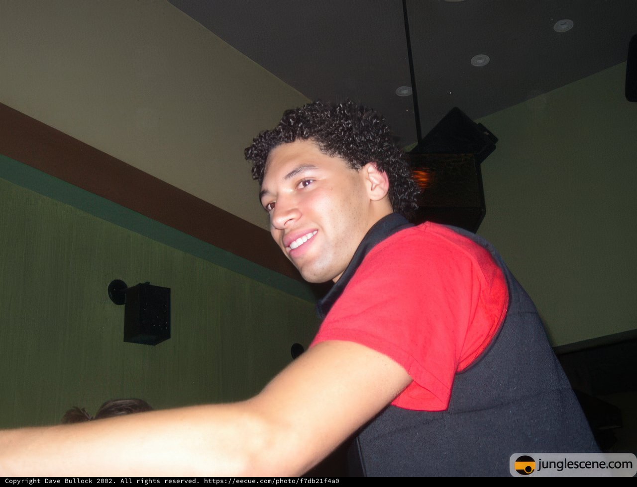 Red Shirt, Black Vest, Big Smile