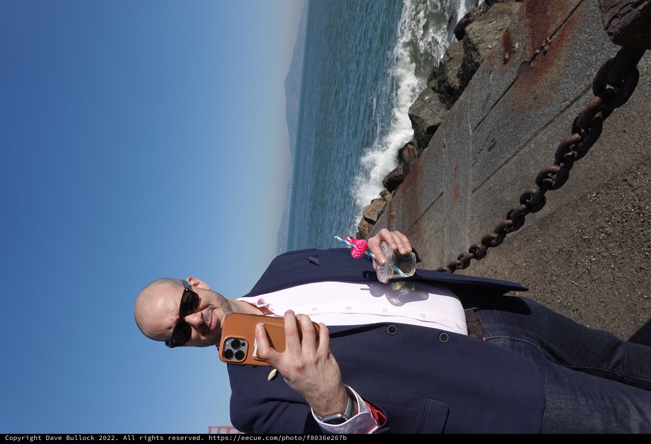 Business Professional Taking Seaside Selfie with Drink