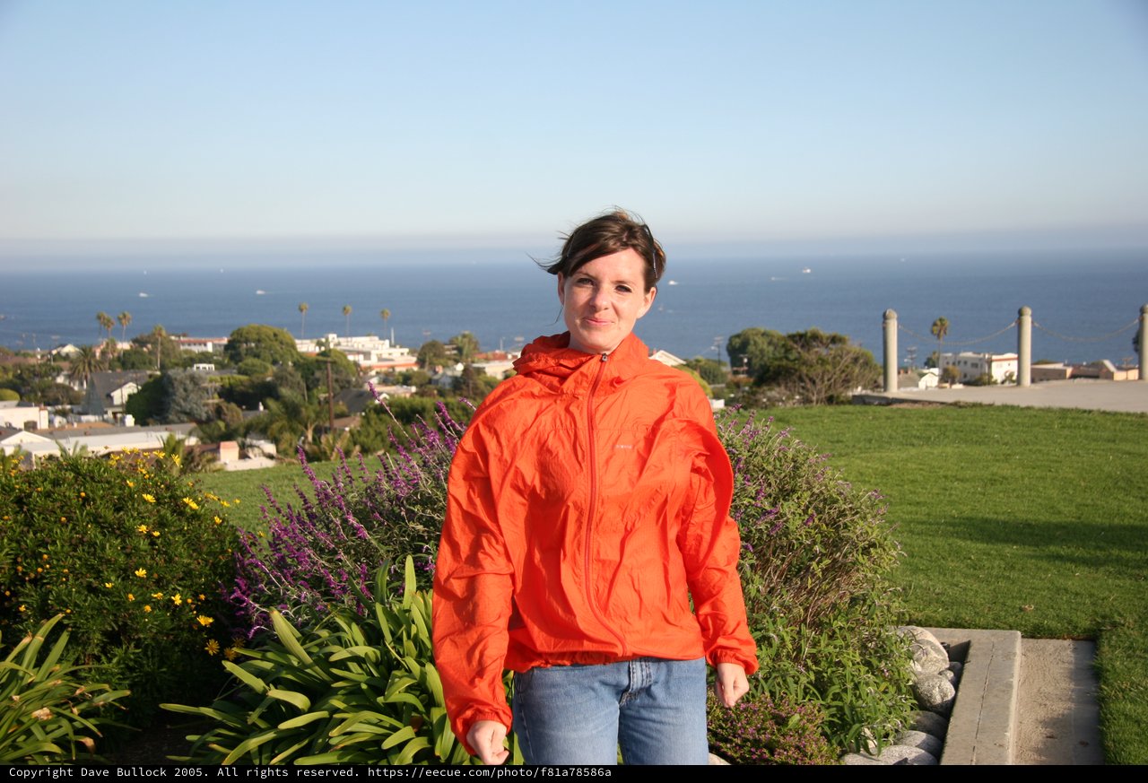 Woman in Orange Jacket by Pacific Coastal Overlook