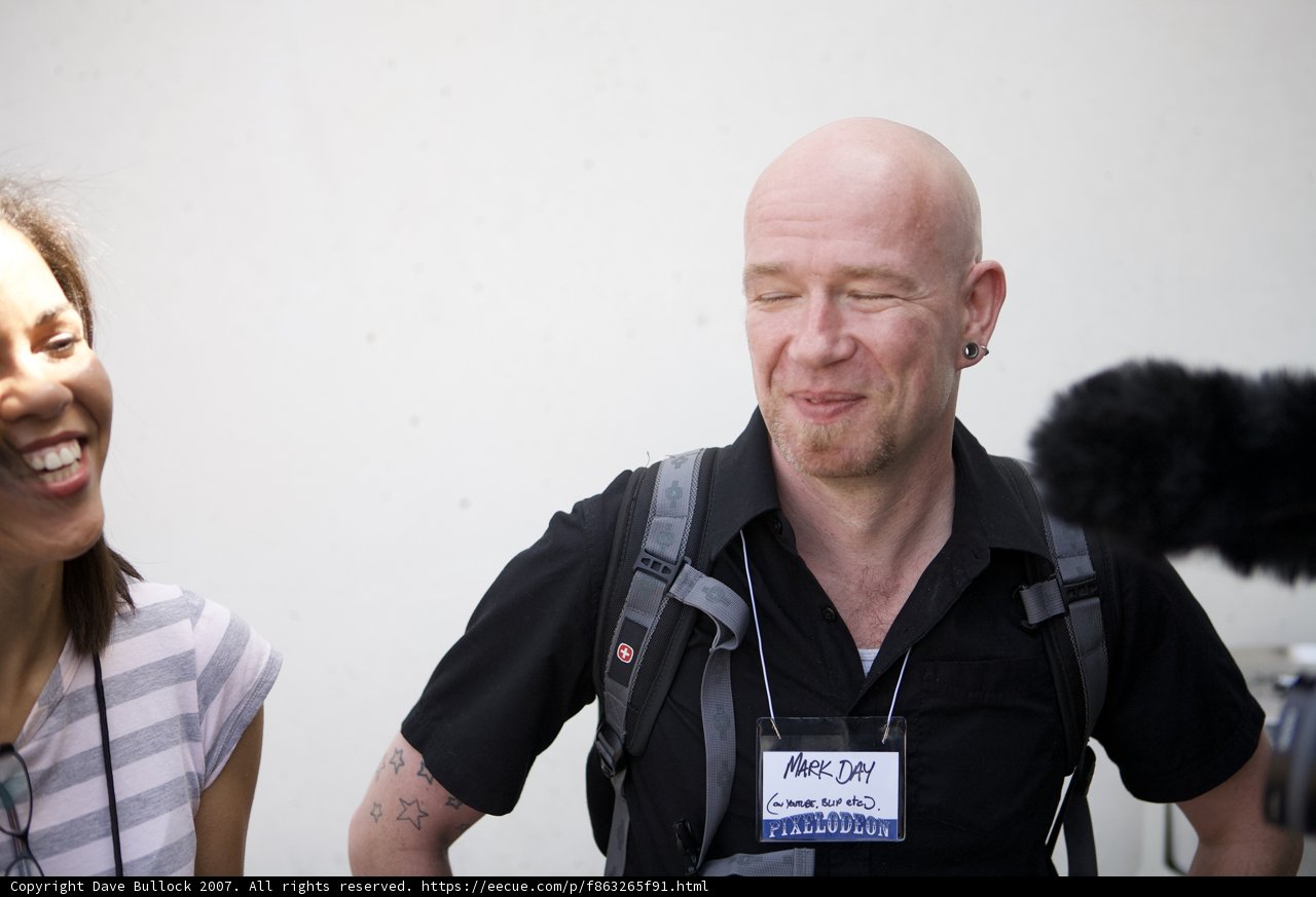 Smiling Bald Man and Happy Woman with Backpack