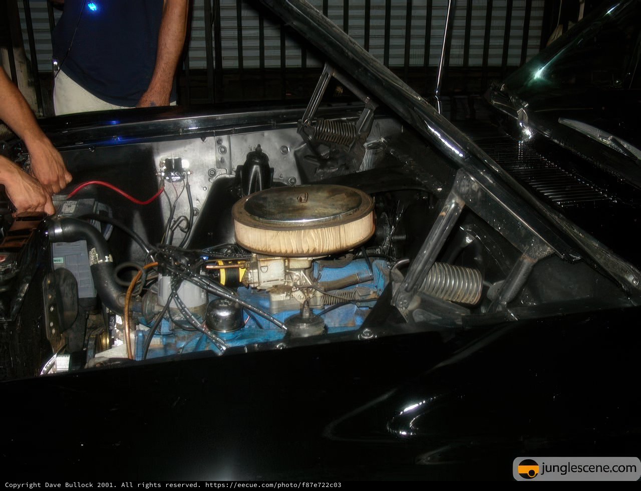 Examining the Engine of a Classic Car