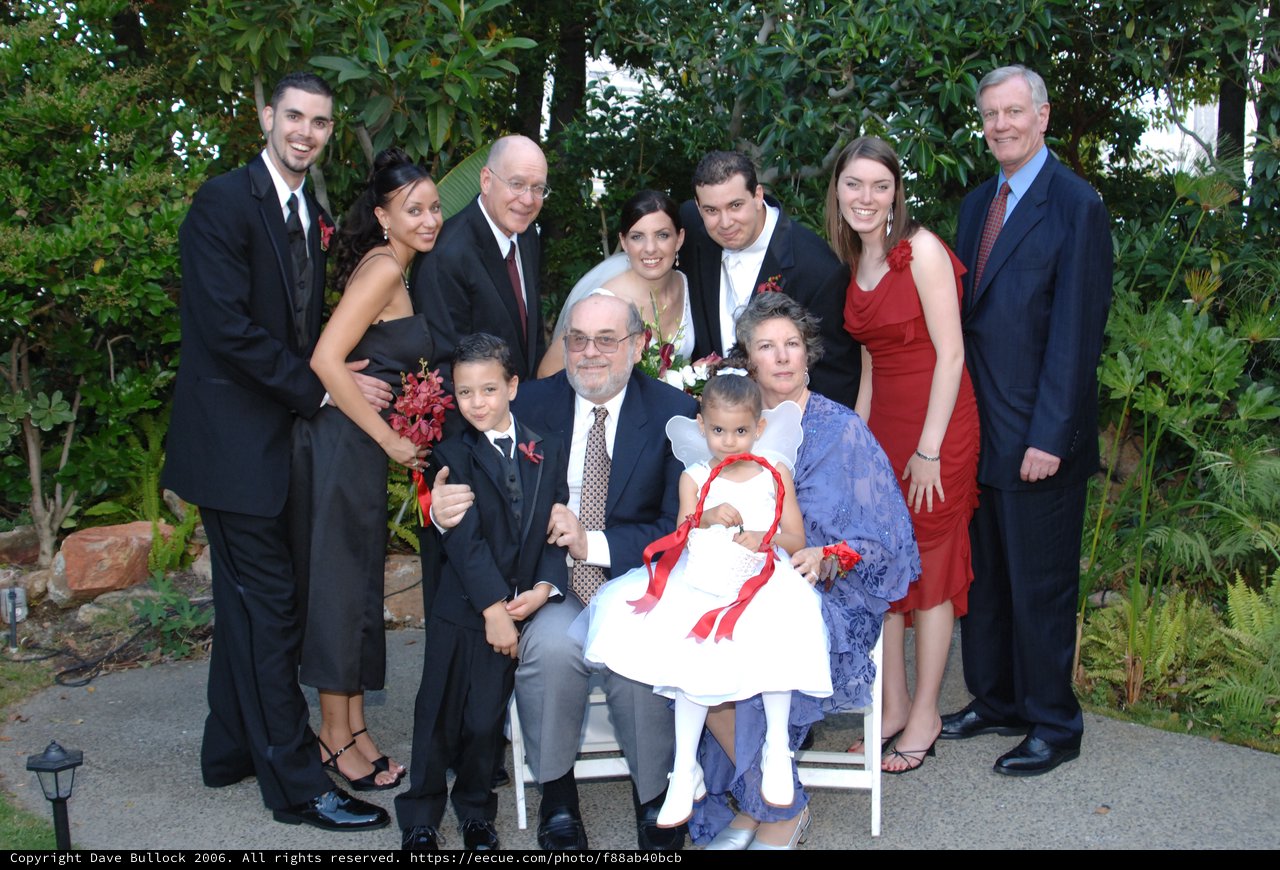 Joyful Wedding Family Portrait in Garden Setting
