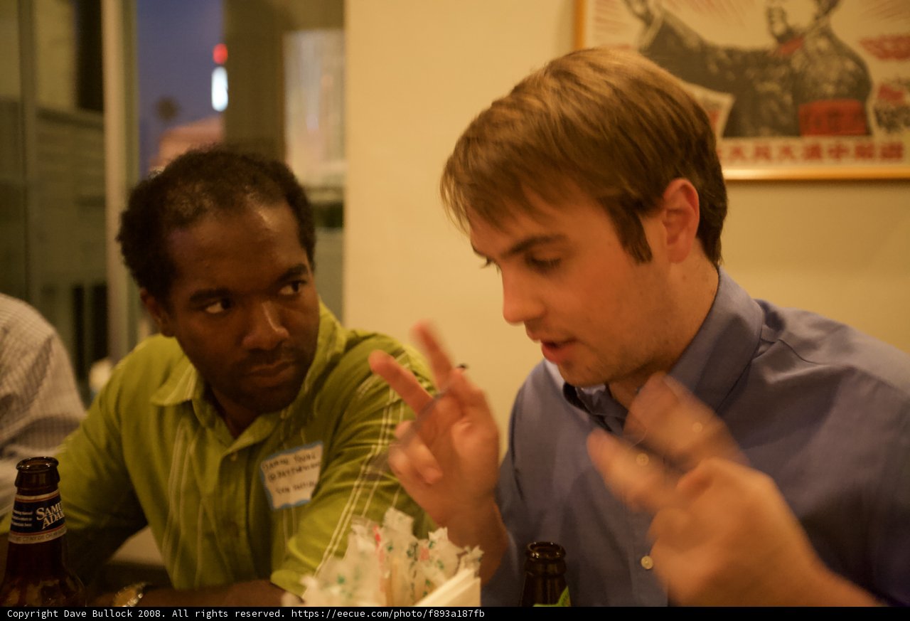 Two Men Enjoying a Cold Beer at the Restaurant