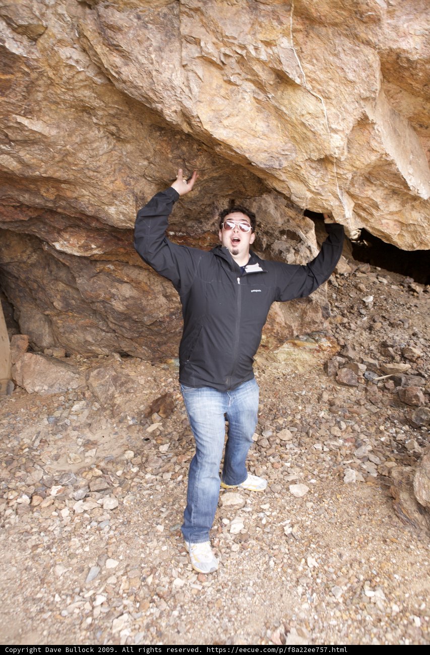 Dave B Standing Proud in Front of the Rock Face