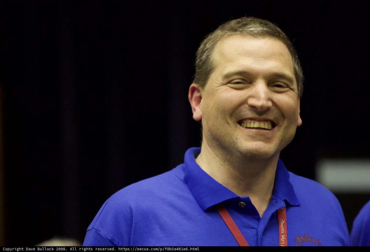 Smiling Man in Blue Polo