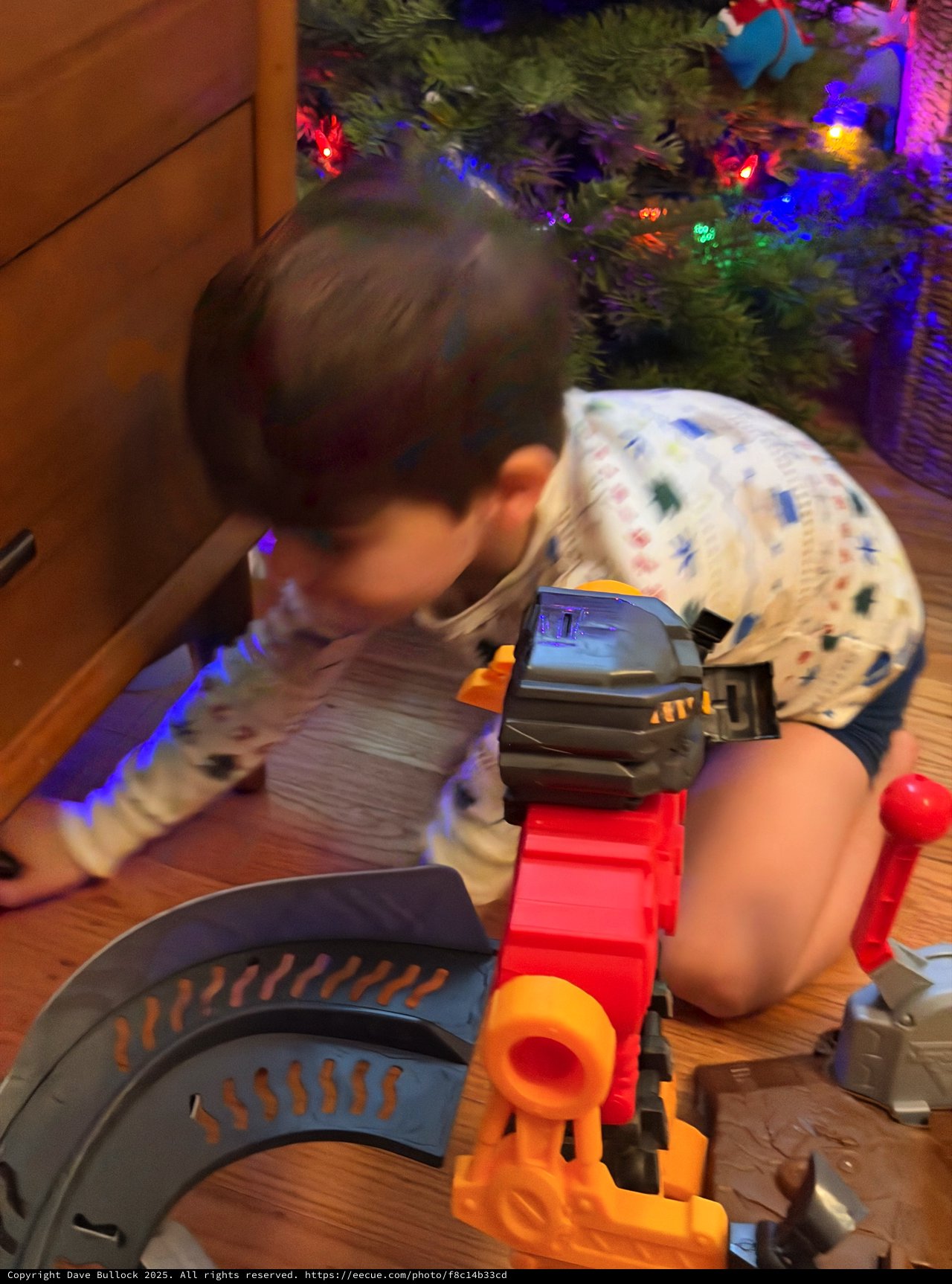 Christmas Morning Play: Child with Toy Train Set