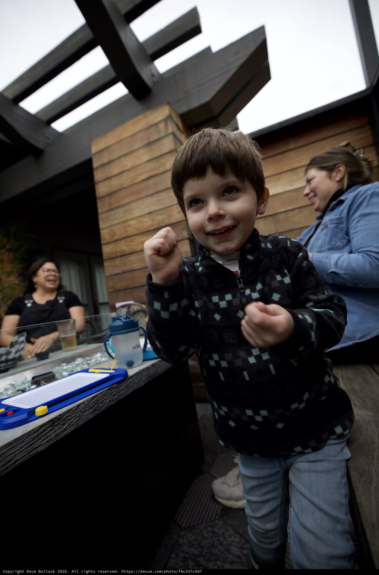 Joyful Child at Outdoor Patio Gathering