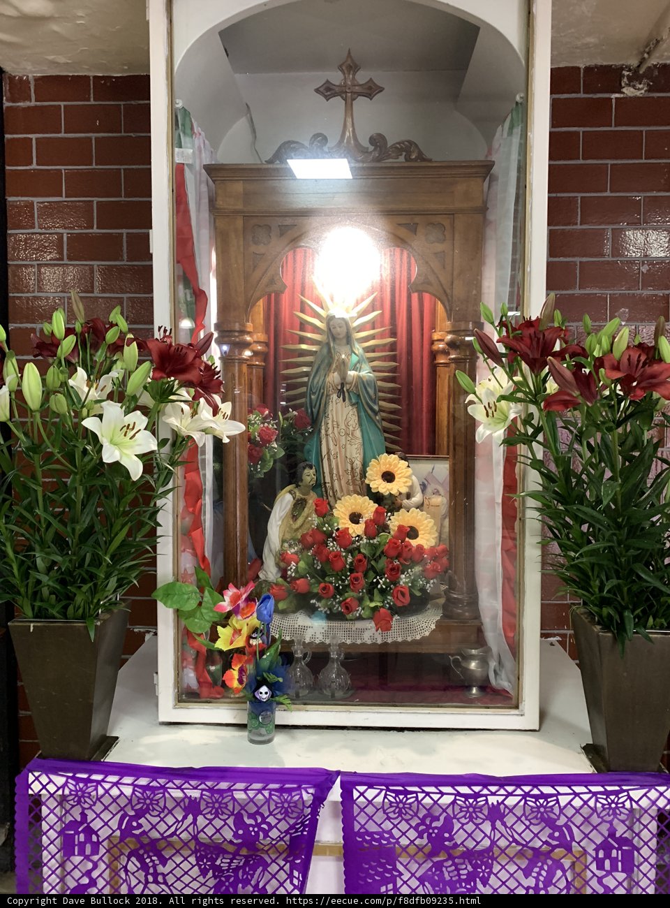 Shrine of the Virgin Mary adorned with Flowers